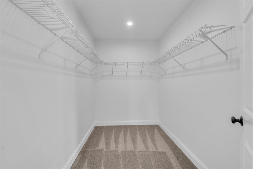 116 Townsend Harbor Road Lunenburg, MA 01462 - Photo 18 of 30 a view of a room with racks on the wall