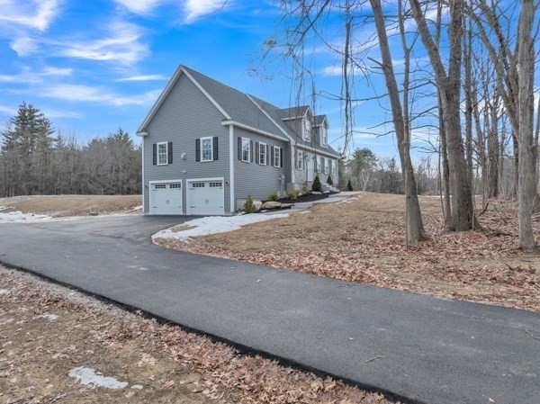 116 Townsend Harbor Road Lunenburg, MA 01462 - Photo 4 of 30 a front view of a house with a yard