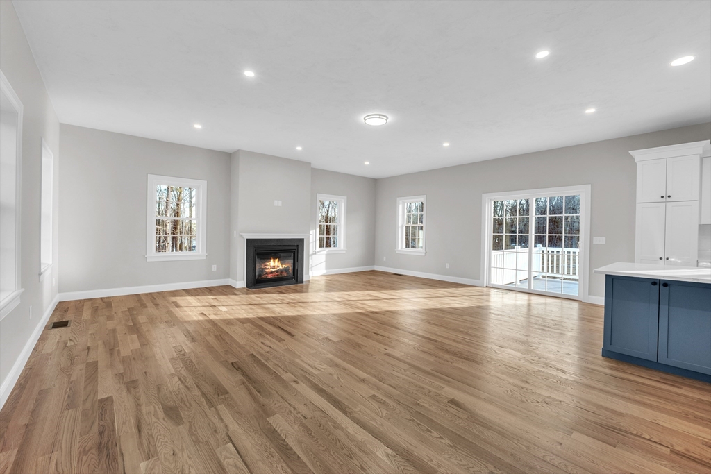 116 Townsend Harbor Road Lunenburg, MA 01462 - Photo 10 of 30 a view of an empty room with wooden floor and a window