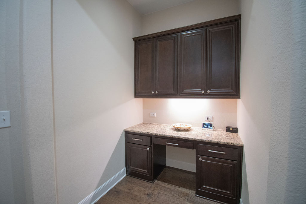 Undisclosed Address Georgetown, TX 78633 - Photo 19 of 39 a utility room with granite countertop cabinets washer and dryer