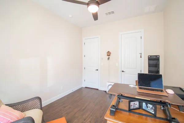 a workspace with furniture and wooden floor