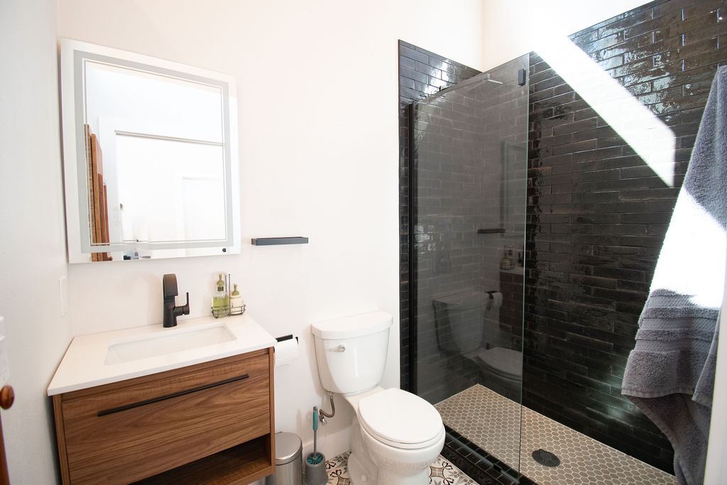 Undisclosed Address Georgetown, TX 78633 - Photo 32 of 39 a bathroom with a sink a toilet and shower