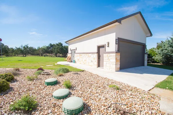 a view of a backyard of a house