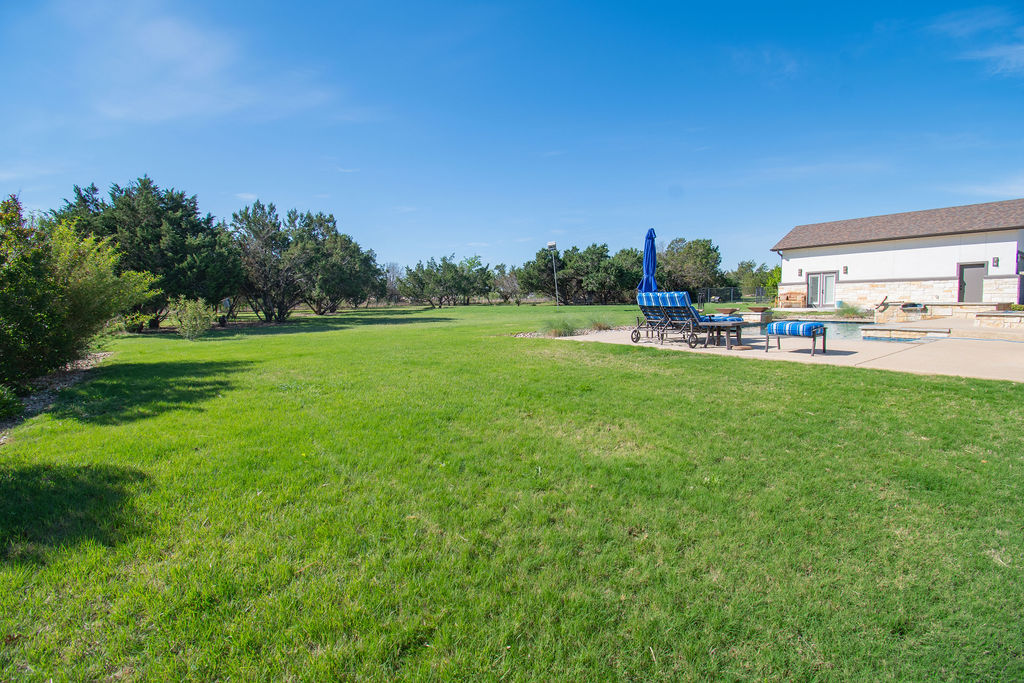 Undisclosed Address Georgetown, TX 78633 - Photo 35 of 39 a house view with a garden space