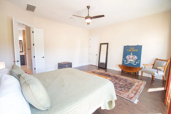 a bedroom with a bed and dresser