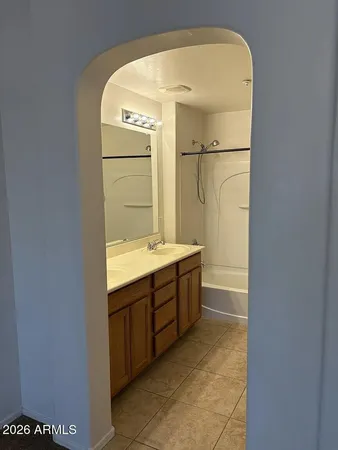 a bathroom with a shower and a bath tub