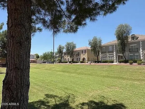 a view of a lake with houses in the back