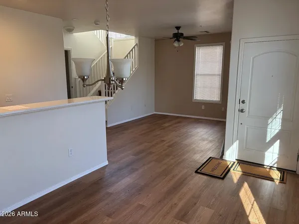 a kitchen with stainless steel appliances granite countertop a stove and a wooden floors