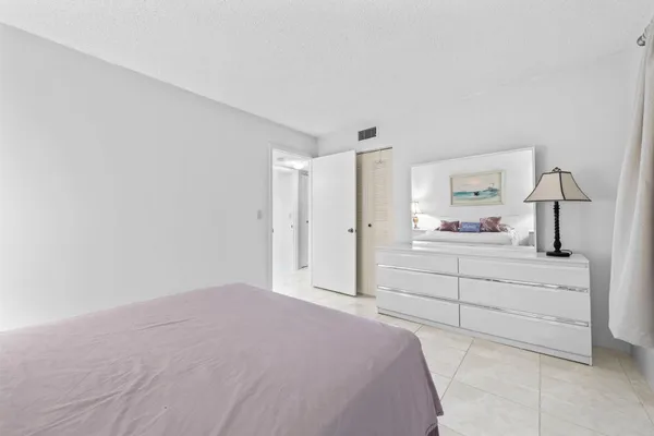 a bedroom with a bed and a cabinets