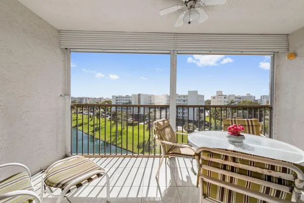 a balcony with furniture and a window