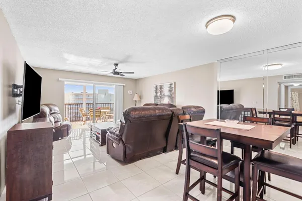 a view of a dining room with furniture and a livingroom