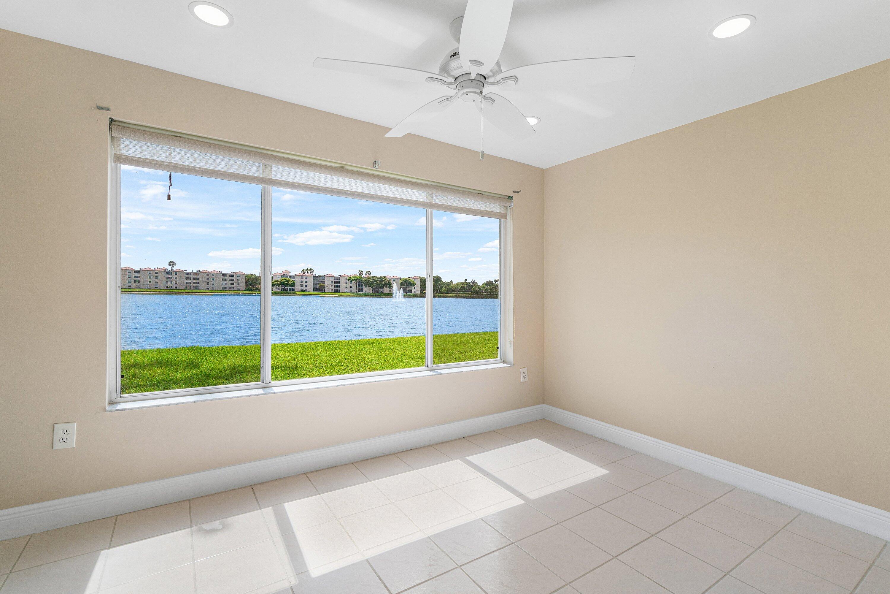 14096 Huntington Pointe Drive, Unit 106 Delray Beach, FL 33484 - Photo 28 of 47 a view of an empty room with a window
