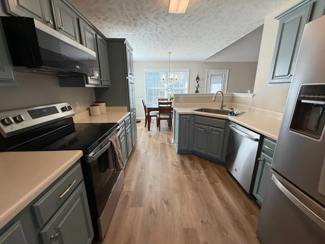 a view of a dining room and chairs