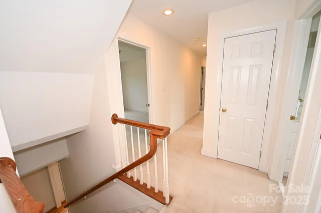 a view of a hallway with stairs