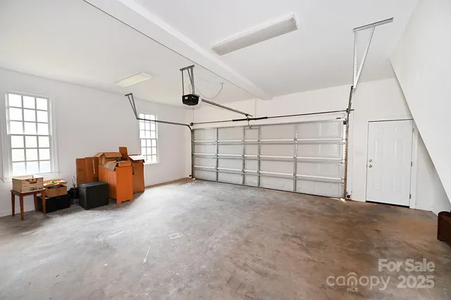 a view of a livingroom with furniture and a window