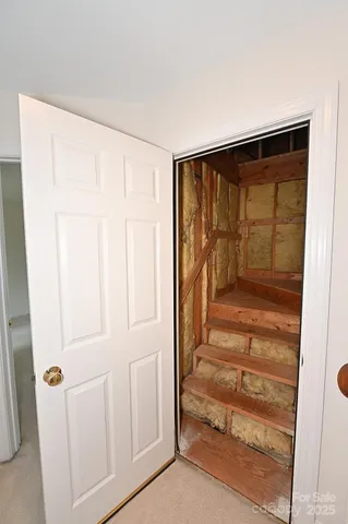 a view of entryway with wooden floor and door