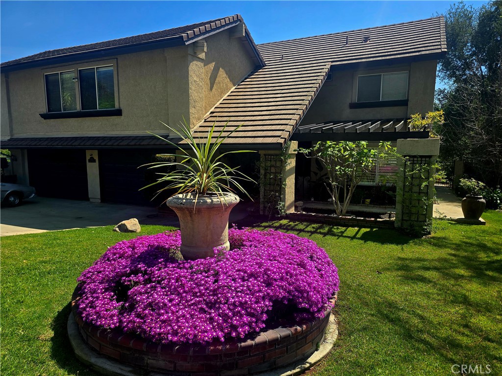 a view of a house with backyard tub and fire pit