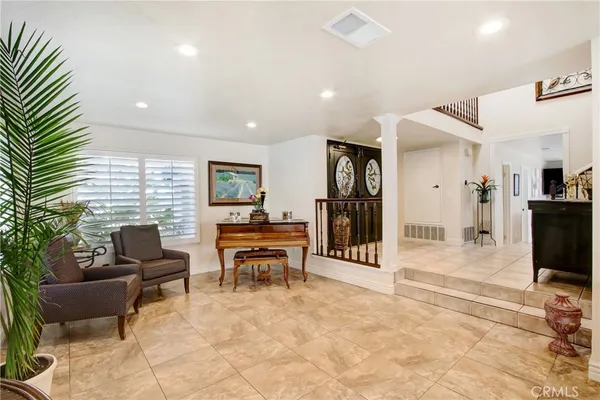a view of a livingroom with furniture and a flat screen tv