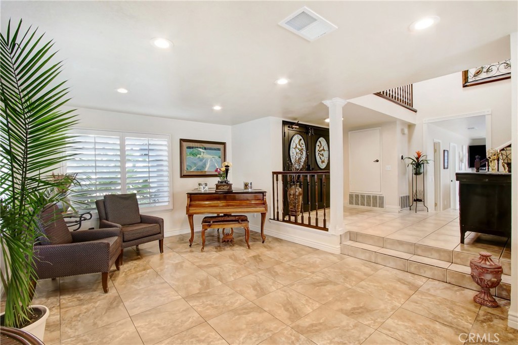 9111 Hidden Farm Road Alta Loma, CA 91737 - Photo 12 of 45 a view of a livingroom with furniture and a flat screen tv