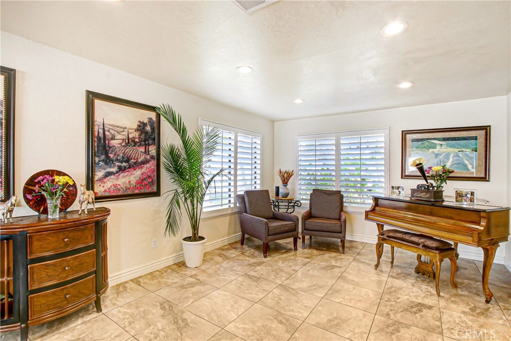 9111 Hidden Farm Road Alta Loma, CA 91737 - Photo 13 of 45 a living room with furniture and a piano table