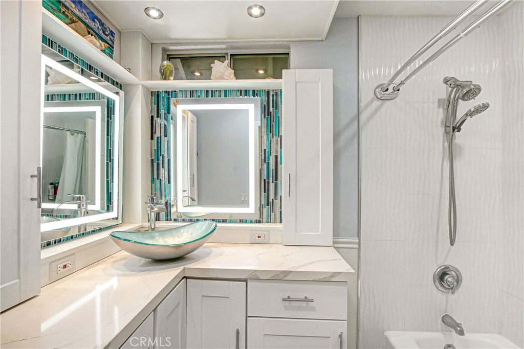 9111 Hidden Farm Road Alta Loma, CA 91737 - Photo 19 of 45 a bathroom with a granite countertop sink and a mirror