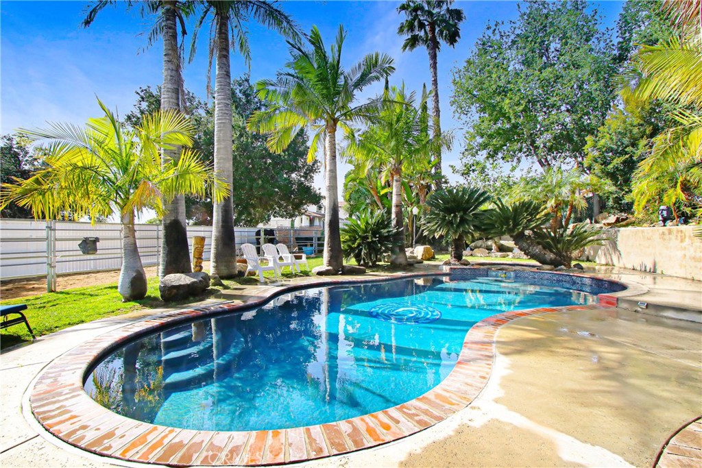 9111 Hidden Farm Road Alta Loma, CA 91737 - Photo 2 of 45 a view of a swimming pool with a patio