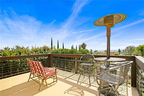 a view of a chairs and table on the patio