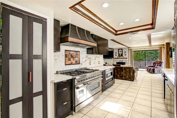 a kitchen with stainless steel appliances granite countertop a stove and a sink