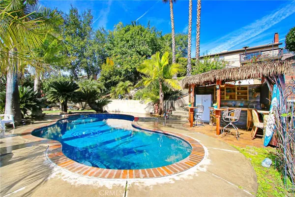 a view of a swimming pool with a patio