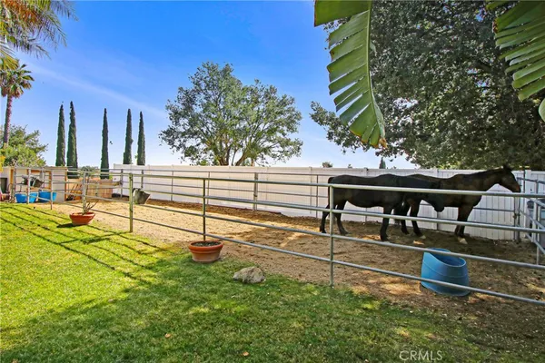 a view of a backyard with sitting area