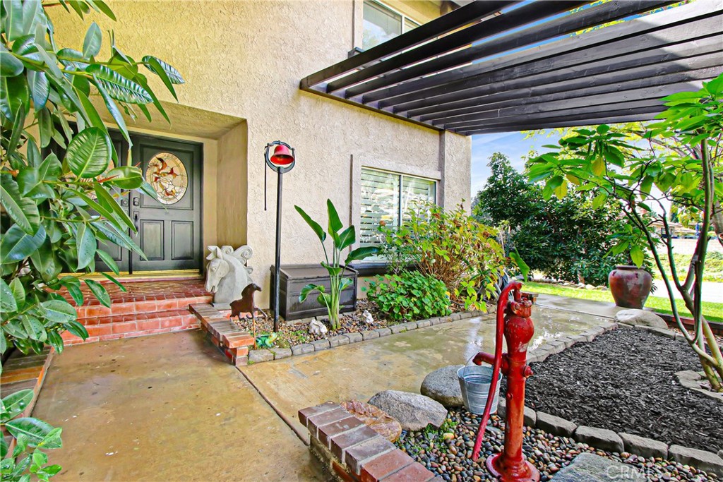 9111 Hidden Farm Road Alta Loma, CA 91737 - Photo 5 of 45 a backyard of a house with seating space