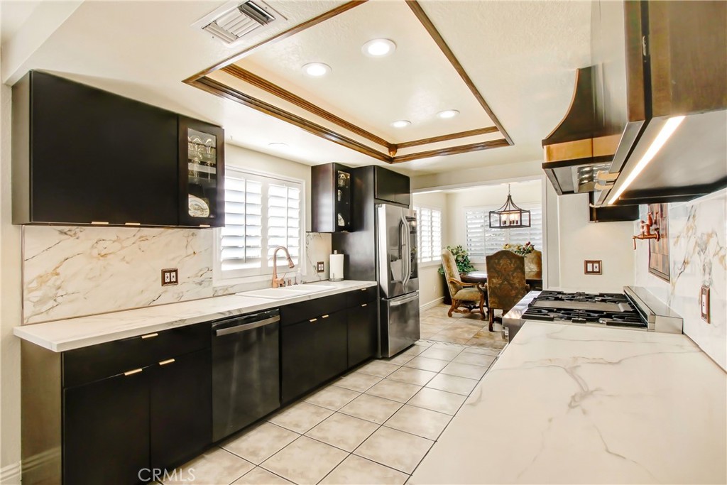 9111 Hidden Farm Road Alta Loma, CA 91737 - Photo 7 of 45 a spacious bathroom with a sink a mirror and a bathtub