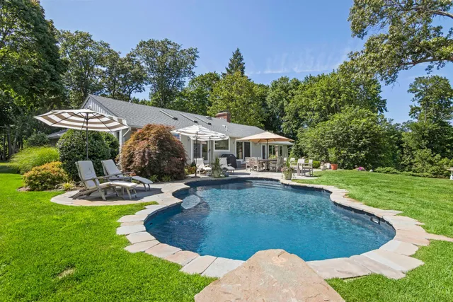 a view of a swimming pool with a patio