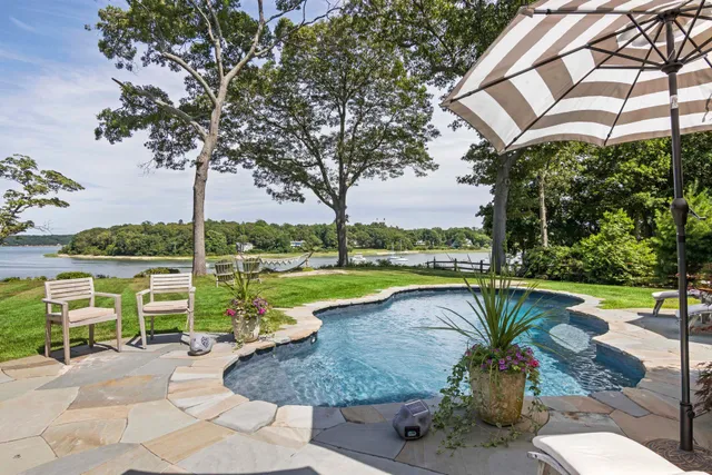 an outdoor space with furniture and umbrella