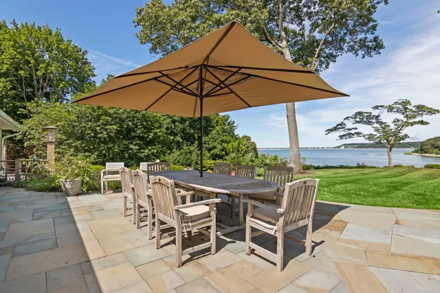 a view of a patio with furniture and backyard