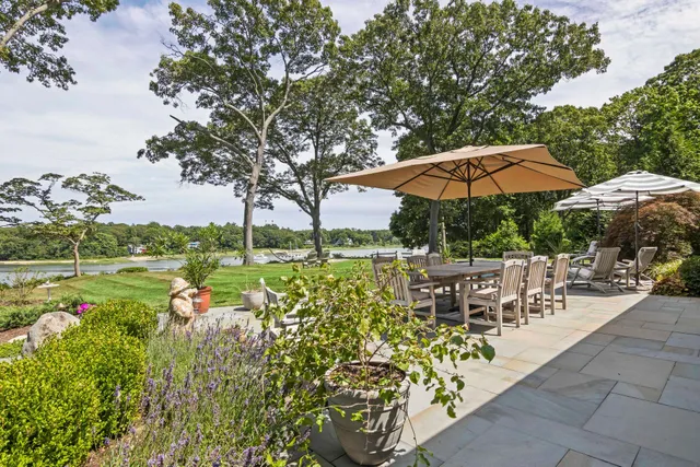 a room with wooden floors and kitchen view