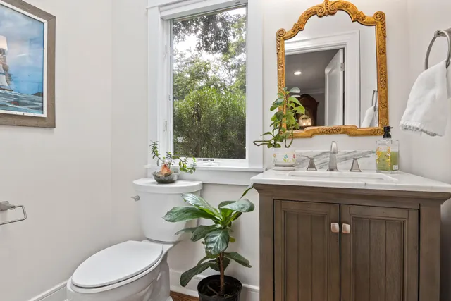 a bedroom with a bed and windows