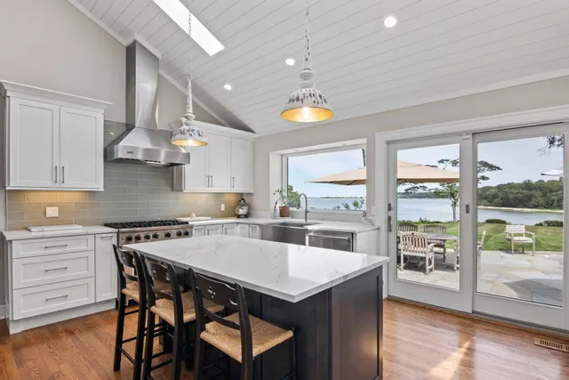 a kitchen with a stove a sink and a refrigerator