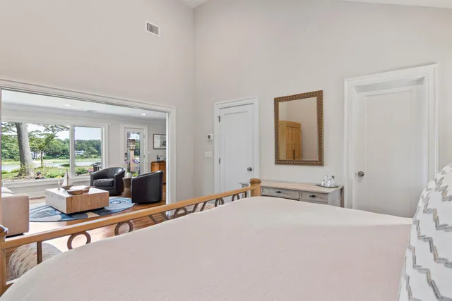 a room with a large bed and furniture