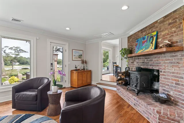 a living room with furniture a window and a fireplace
