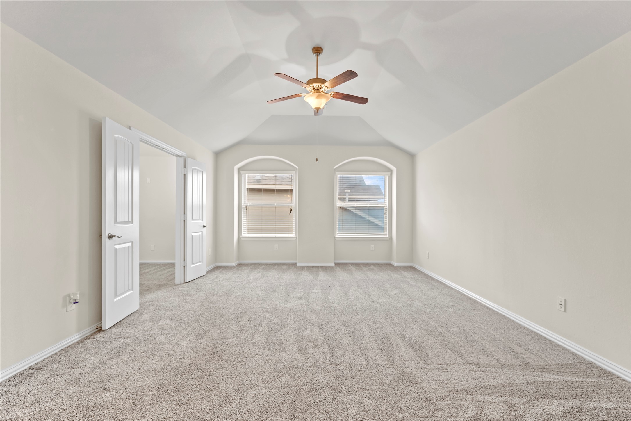 5205 Rainy Garden Court Rosharon, TX 77583 - Photo 27 of 40 an empty room with chandelier fan and windows