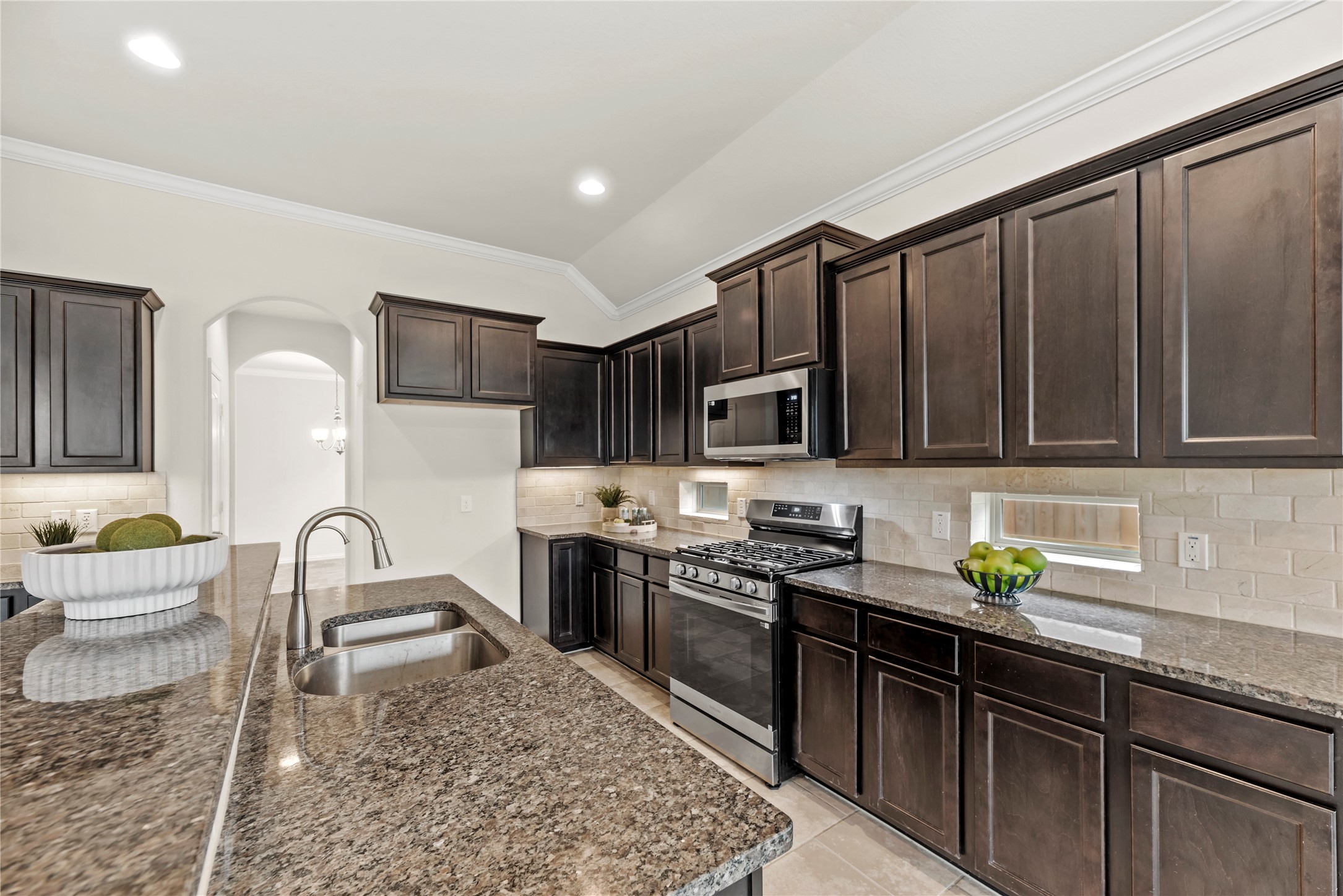 5205 Rainy Garden Court Rosharon, TX 77583 - Photo 3 of 40 a kitchen with stainless steel appliances granite countertop a sink stove refrigerator and cabinets