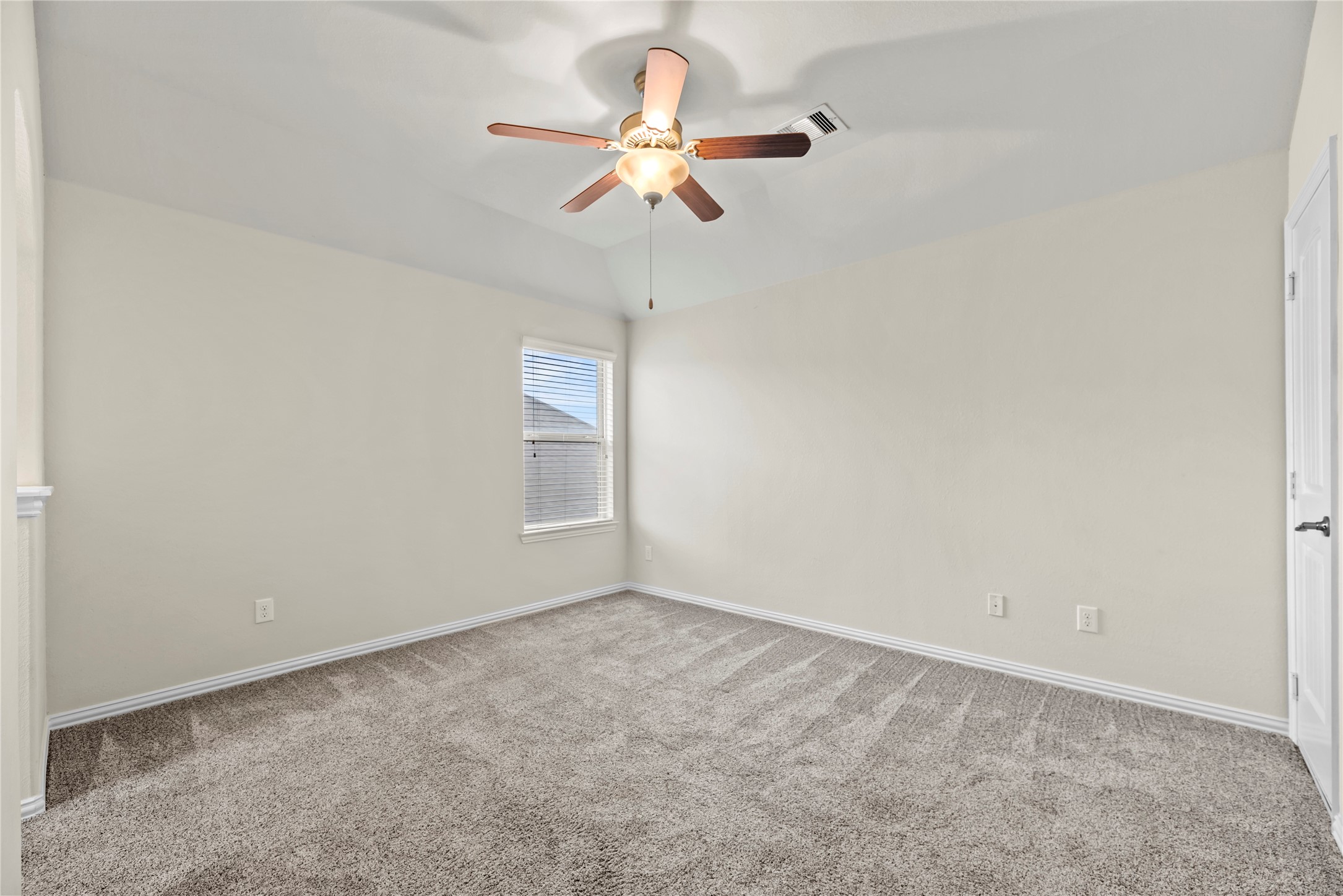 5205 Rainy Garden Court Rosharon, TX 77583 - Photo 31 of 40 an empty room with a window and a fan