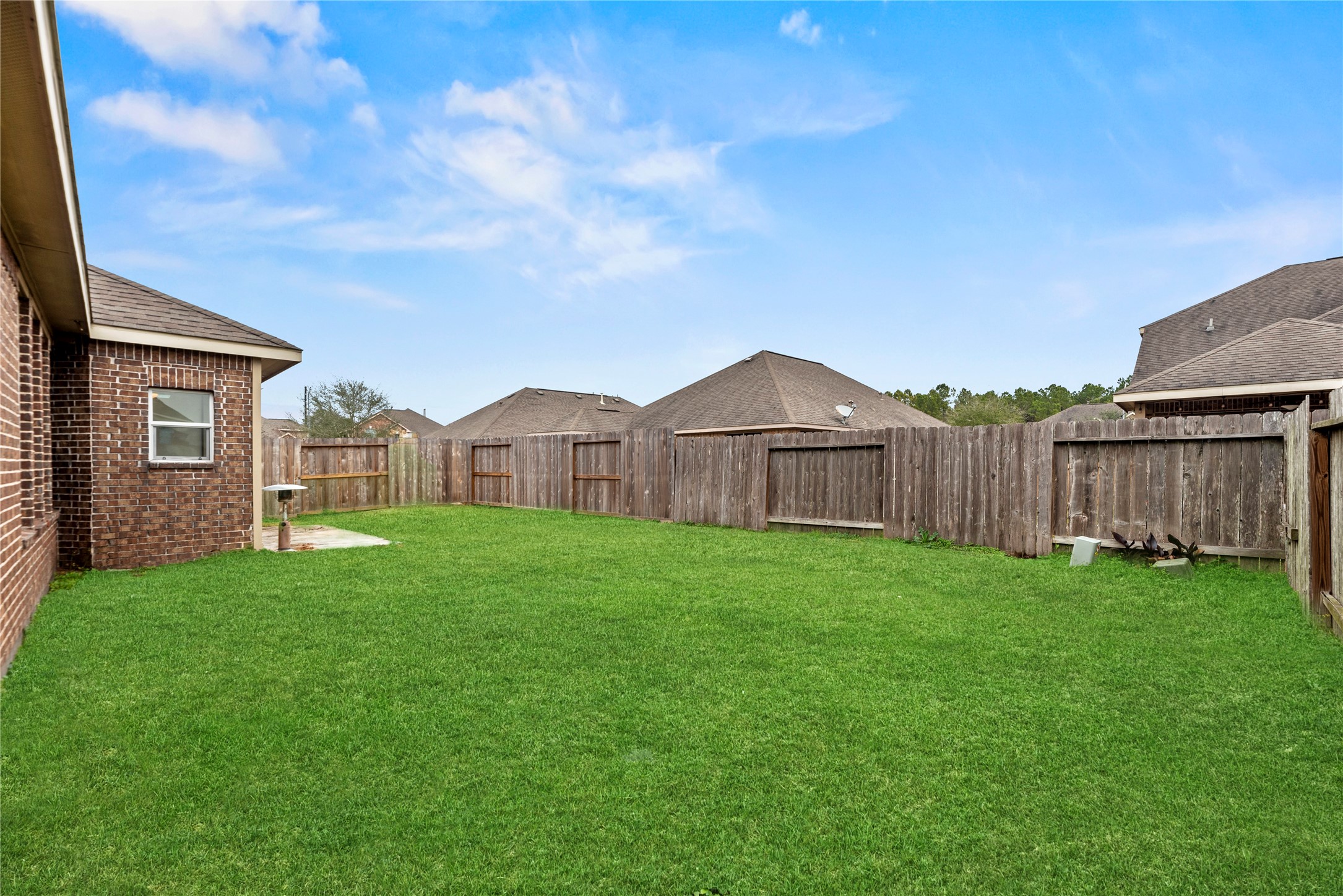 5205 Rainy Garden Court Rosharon, TX 77583 - Photo 35 of 40 a view of a house with backyard and garden