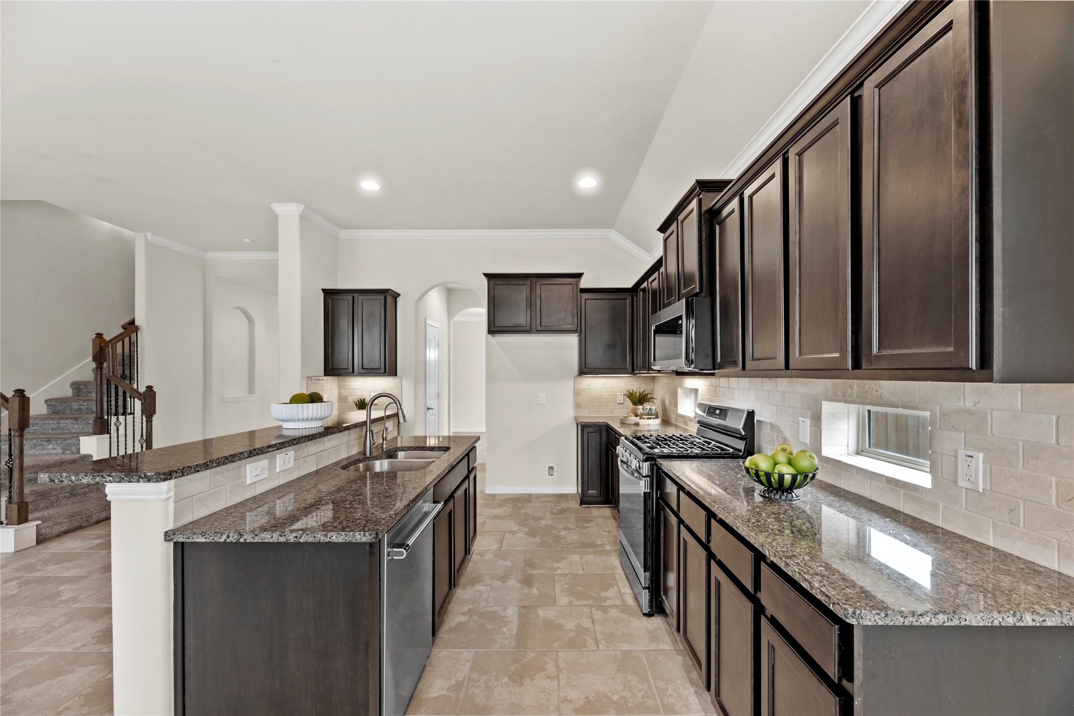 5205 Rainy Garden Court Rosharon, TX 77583 - Photo 7 of 40 a kitchen with stainless steel appliances granite countertop a sink stove and cabinets