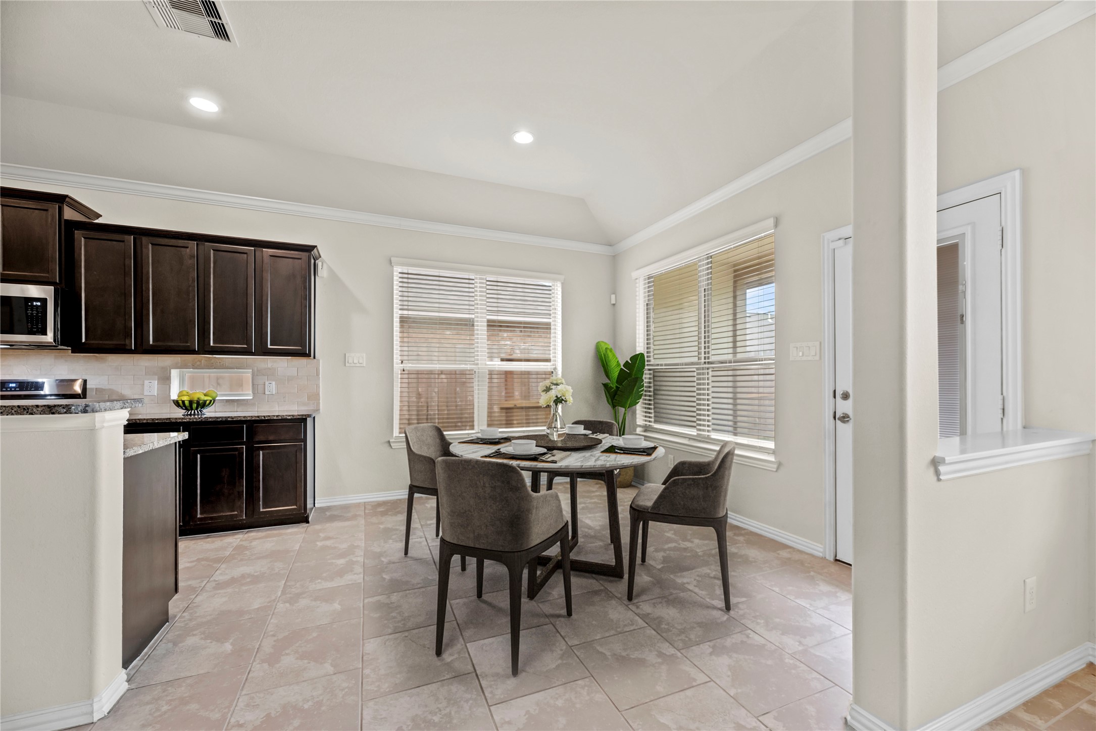 5205 Rainy Garden Court Rosharon, TX 77583 - Photo 9 of 40 a view of a dining room with furniture window and wooden floor