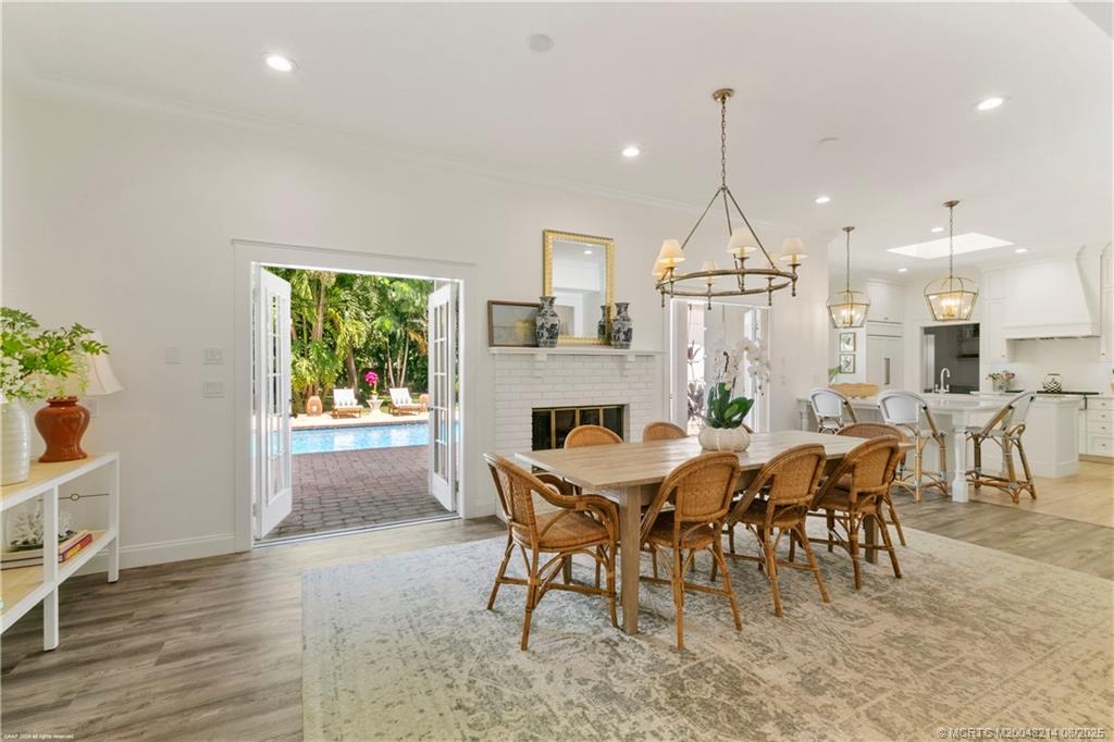 16 Ridgeview Road North Sewall's Point, FL 34996 - Photo 28 of 88 a dining room with furniture and a floor to ceiling window