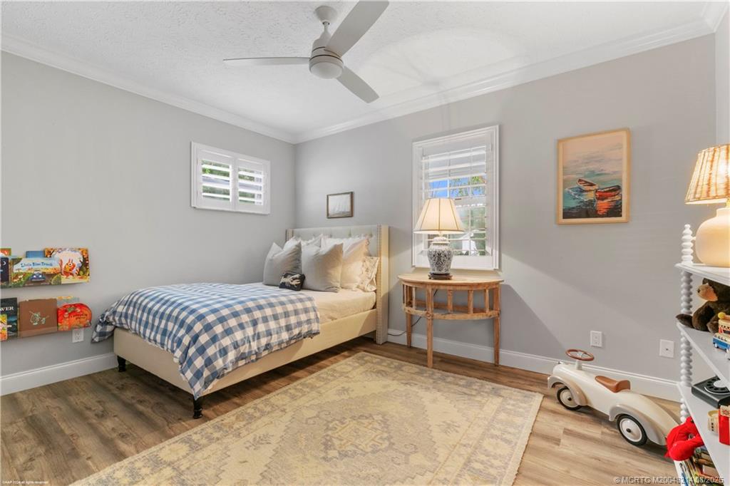 16 Ridgeview Road North Sewall's Point, FL 34996 - Photo 51 of 88 a bedroom with a bed and a window
