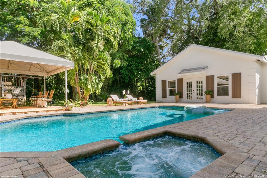 16 Ridgeview Road North Sewall's Point, FL 34996 - Photo 76 of 88 a view of a house with pool table and chairs