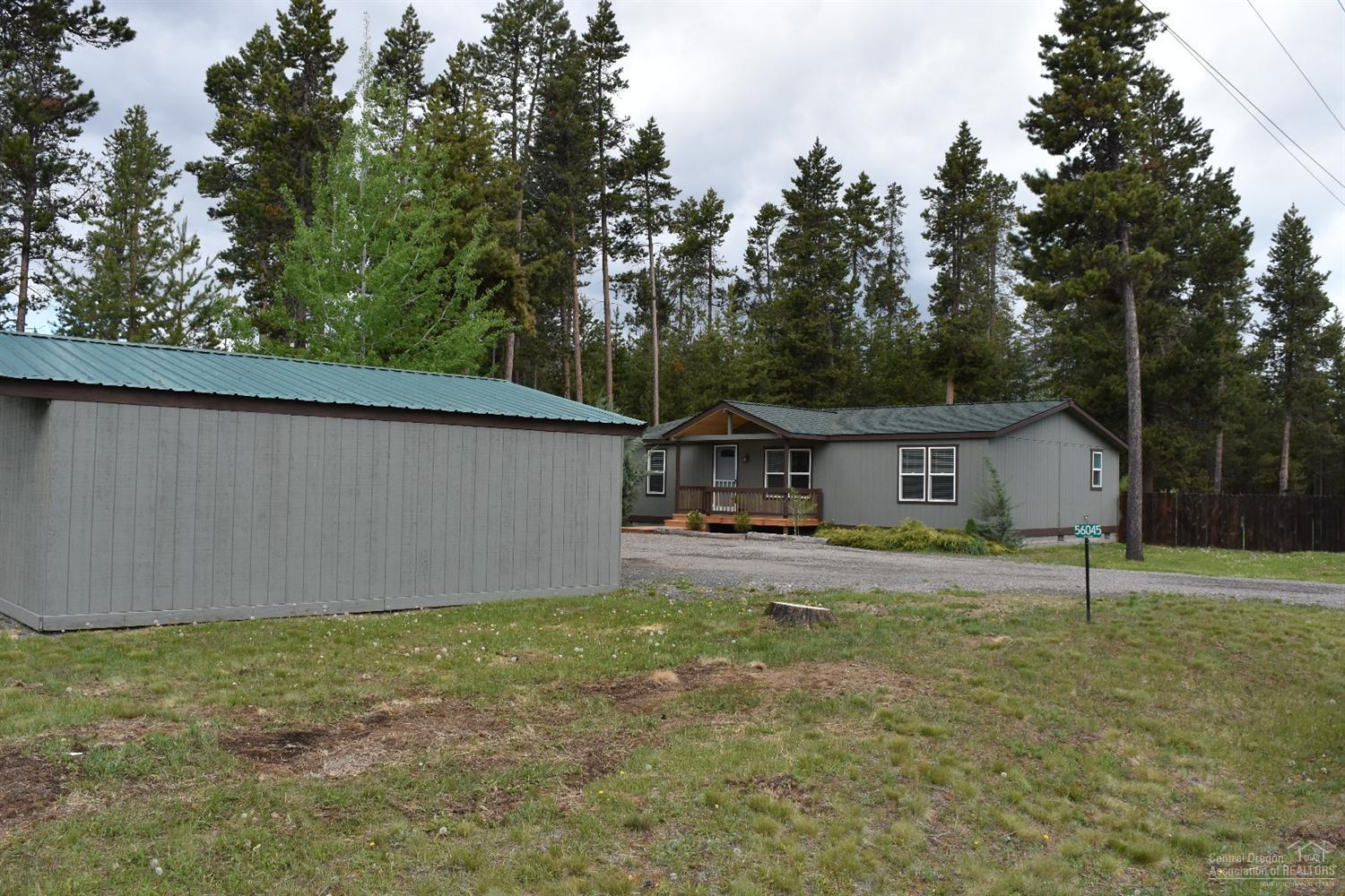 56045 Black Duck Road Bend, OR 97707 - Photo 6 of 22 a view of a house with a backyard